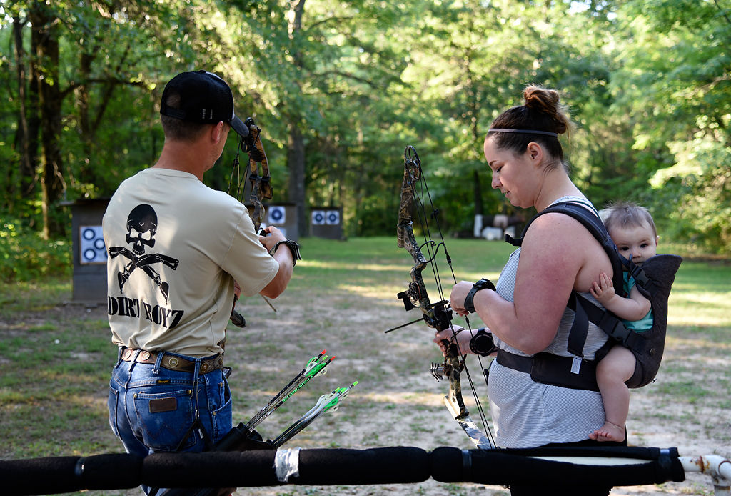 Colten and Shelby Barron warm up before competing in 3D archery